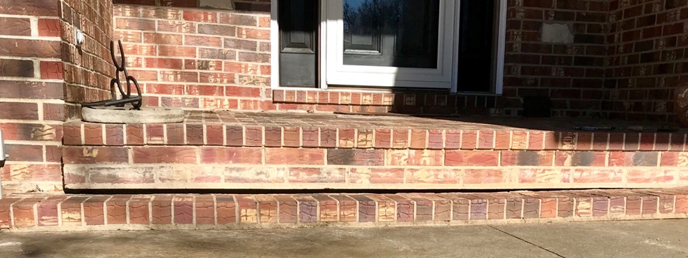 Sunken concrete slab before polyurethane foam leveling in Kansas City